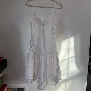 white dress with button up detailing on the back